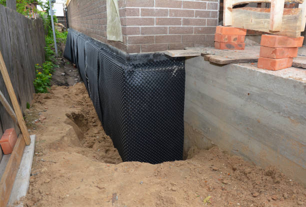 Happy homeowners after waterproofing job in Beaver